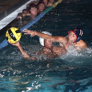 BLOCKED PASS. In the game against Colonial, freshman Guancarlos Ottone tries to block opponent's pass. photo/LIAVILLAR