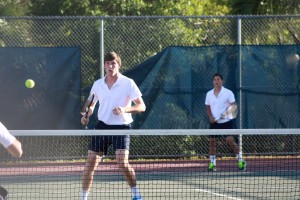 Seniors Remy Artavia and Samuel Lampman play in a doubles match. The two won 8-1. photo/OLIVIA QUATTRONE
