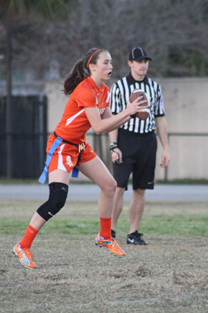 FAKE OUT.  In the game against Freedom on March 15, sophomore quarterback pauses before running the ball.