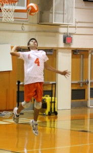 FOR THE ACE.  In the game against Bishop Moore junior Samuel Furukawa serves the ball.