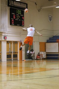 SERVICE.  Senior Matthew Combs sets up for a jump serve in a competitive game. photo/ DELANEY ARKIELPANE