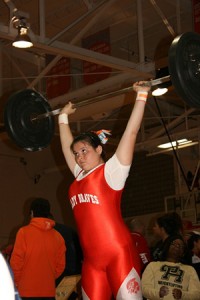CLEAN LIFT.  In the clean and jerk, freshman Kelsie Smith completes her lift.  photo/AVERY REDDECK