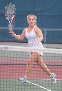 SERVED. In her singles match, sophomore Ashlyn Gage defeats her opponent, 8-2. photo/BLAKE WARANCH