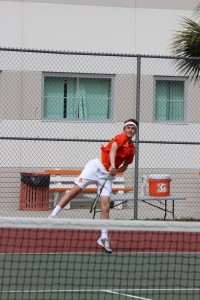 SERVES UP. In the match against Hagerty, senior Davis Coleman serves the ball. photo/JOVANN MARTIN
