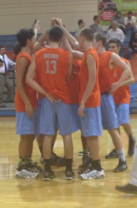 COME TOGETHER.  After a loss to Lake Nona, the boys volleyball team huddles up to discuss the game.