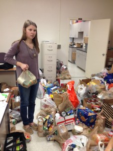 CANNED CRAZE. As a part of her SGA duties, sophomore Sophia Brown delivers canned goods. 