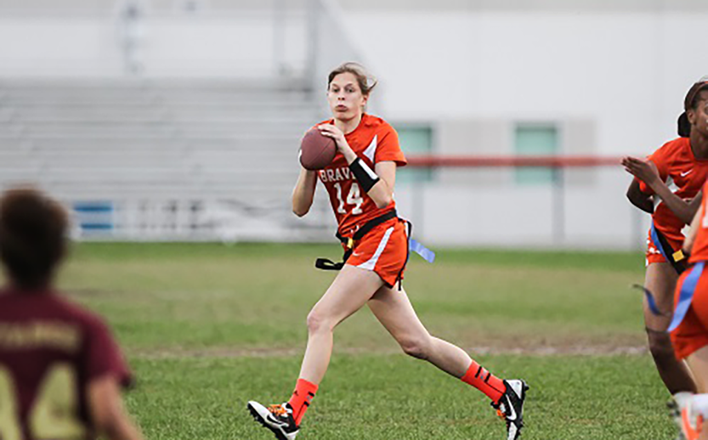 THROW SOME MO'. Junior quarterback Emily Colvin hunts for an open receiver downfield. photo/Phabulous Photos