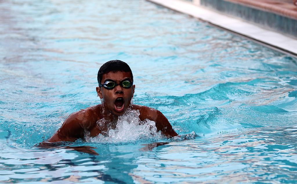 Jose Rodriguez takes a breath as he swims his relay. photo/Lara Dusing