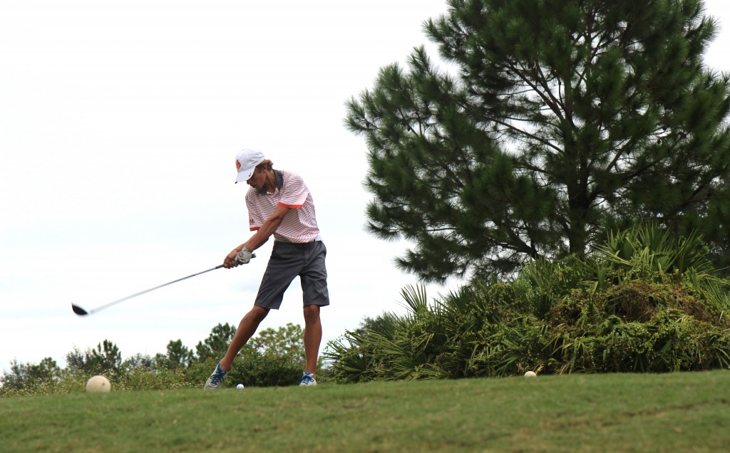 HIT THE MARK. Teeing off to start the match senior Nicholas Duffy finishes first hole with a par. photo/grace asbury