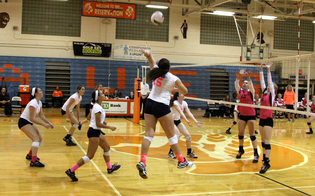 SKY HIGH. Junior Sydney Ritten goes in for the kill. photo/Camille Kalis