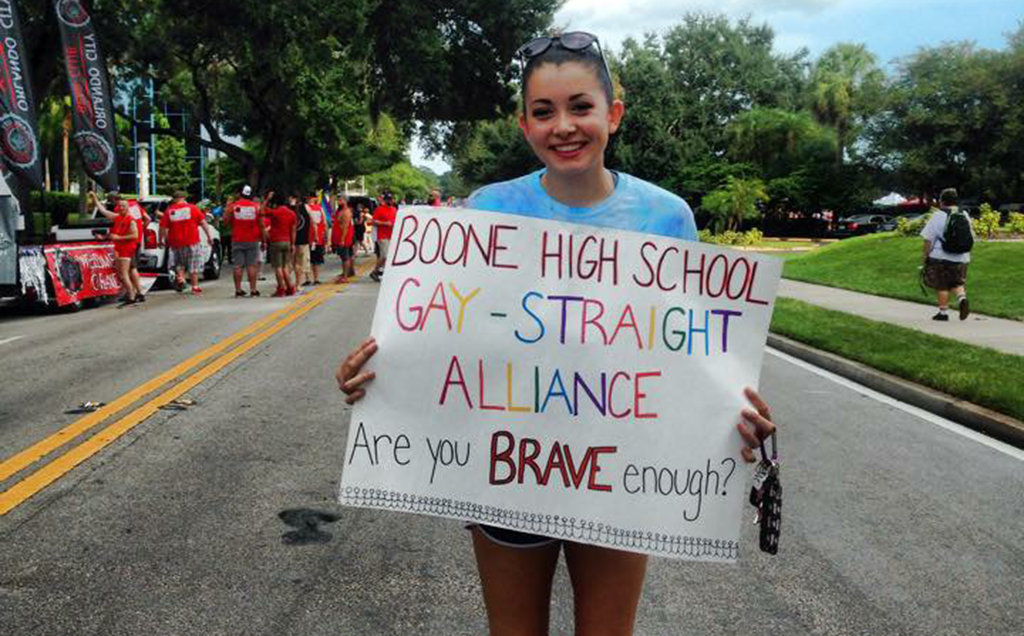 PRIDEFUL. At the Orlando Come Out with Pride Parade on Oct. 10, senior Isabel Beard poses with her sign she made in Gay-Straight Alliance. photo courtesy/Isabel Beard