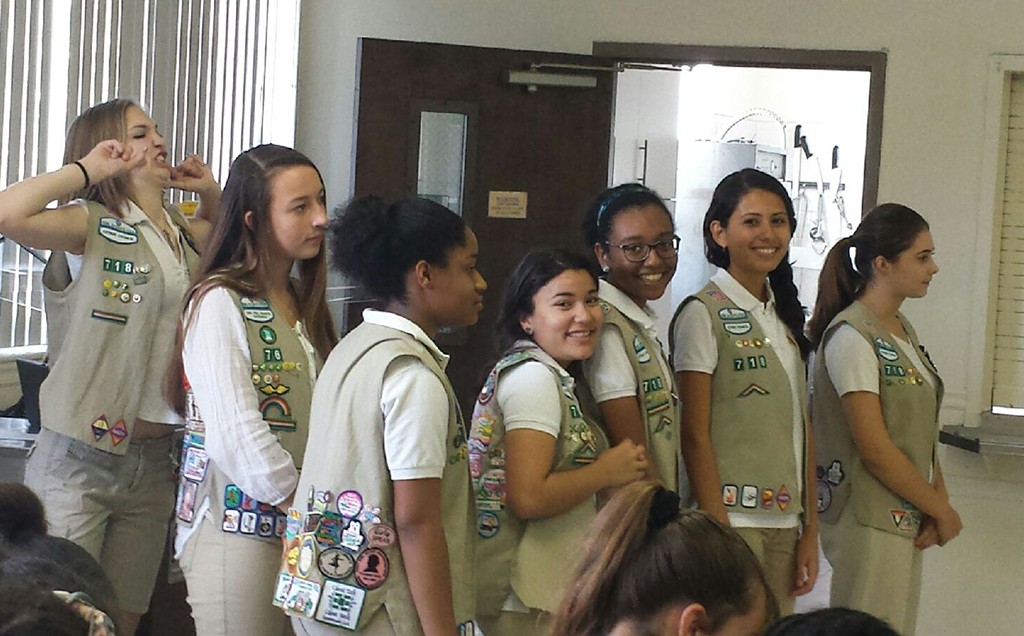 WINNER WINNER. Posing for a picture, the Girl Scouts wait to walk across the stage for the bridging ceremony. "I love the adventures that we get to have together and the family that we have formed as a troop," junior scout Kiara Zambrana said. Zambrana is currently an Ambassador Scout.