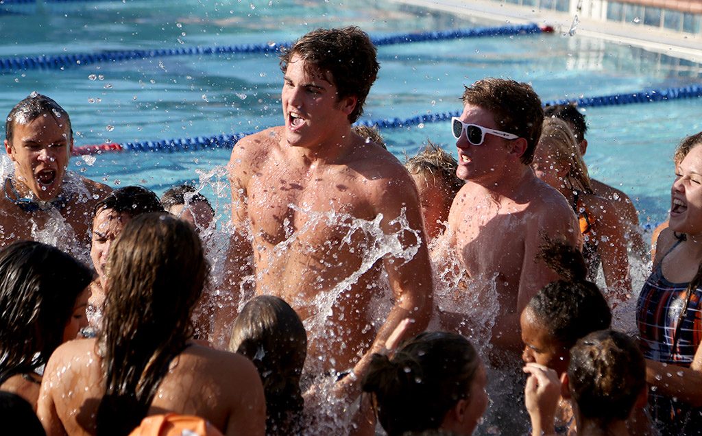 WE ARE THE BOONE BRAVES. Senior Travis Stuart starts the meet with their traditional chant. photo/Jae Crawford 