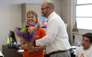 AWARD ACCEPTED. Dusty Johns hands Jennifer Caperton a bouquet of flowers as he congratulates her for her win.