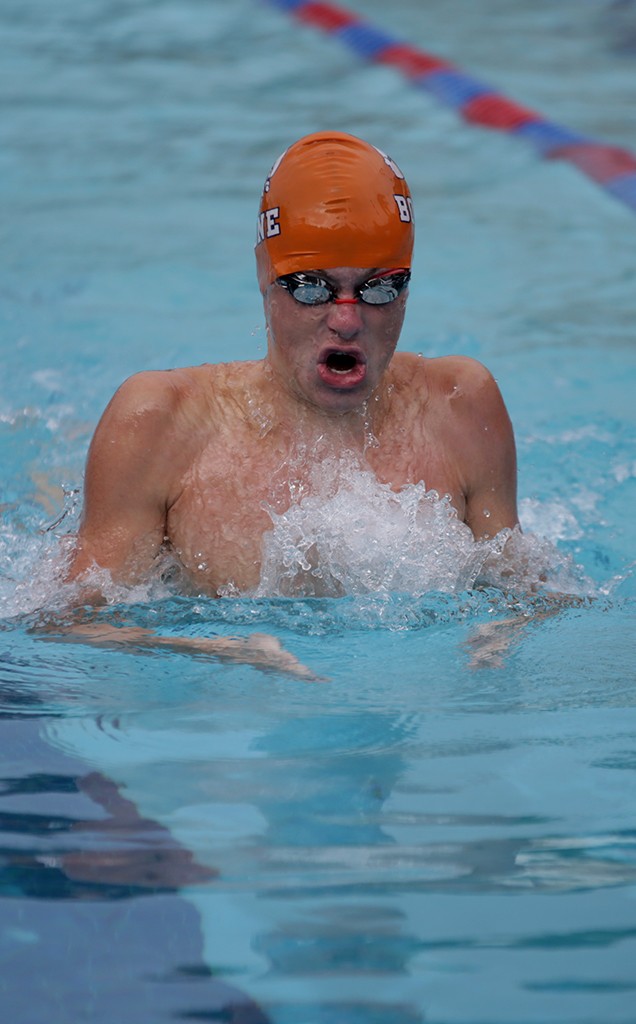 TAKE A BREATH. Sophomore Russell Dagon swims in the 100 breaststroke. photo/Megan Pirino