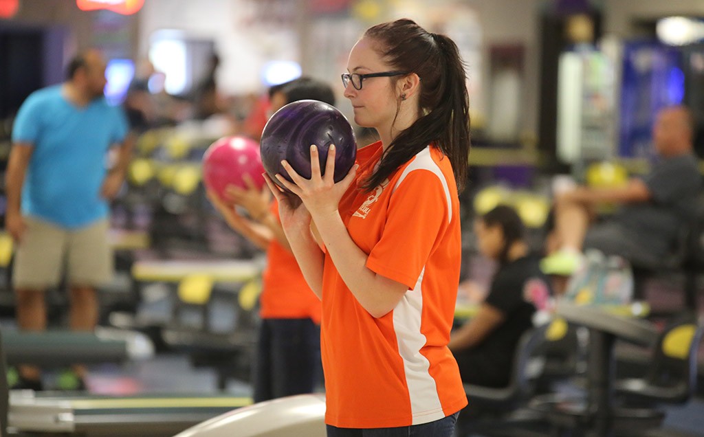 FOCUS. Junior Serina Wright focuses on the pins before rolling.