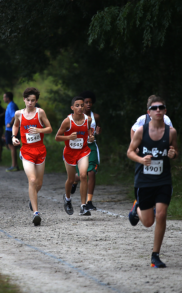 PUSH IT. Attempting to pass their opponents, freshmen Charles Bramuchi and Isaac Figueroa speed up their pace. 
