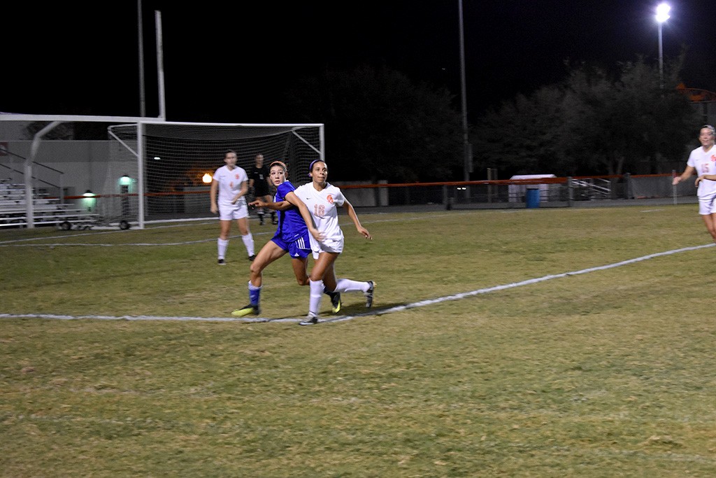 Senior Lindsay Jackson runs to defend the goal and bring it back down to score. 