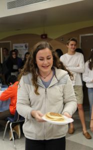 WATCH OUT. When receiving pancakes, the chef offered to flip them onto students plates. photo/Tiffani Rasberry