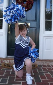 Emma in her cheer uniform
