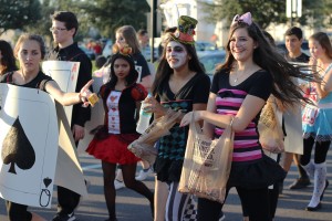 Students in the Parade giving out candy 