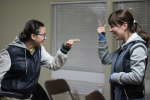 Nayeli Reyes and Stephanie Gonzalez having a conversation in ASL at Deaf Bible study.