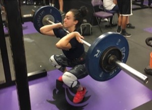 Hilda Ortiz lifting 150 pounds at practice. Ortiz has been on girls varsity weightlifting team since her freshman year. She is now a junior and plans to stay on the team next year. “The coaching is great and the team is very dedicated it helps really bring the team together.” 